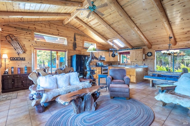 tiled living room with beam ceiling, wooden walls, a skylight, and wooden ceiling