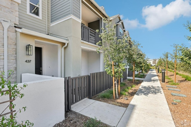 view of community with a fenced front yard