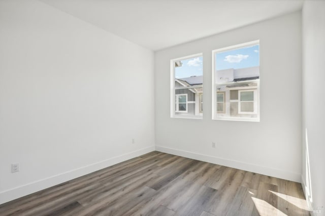 unfurnished room featuring wood-type flooring