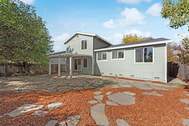 rear view of house featuring a patio