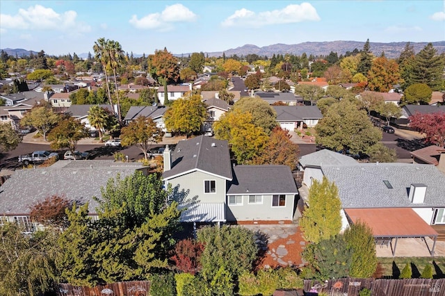 birds eye view of property featuring a mountain view