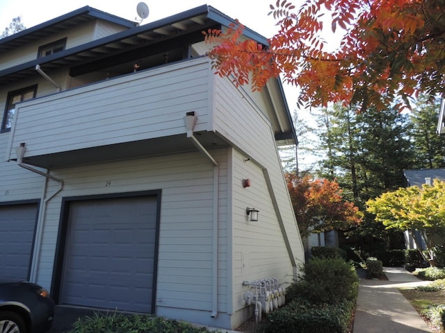 view of property exterior featuring a garage