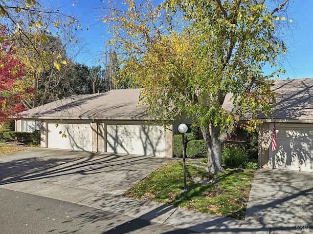 obstructed view of property featuring a garage