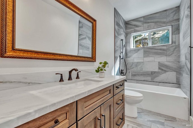 full bath with toilet, marble finish floor, shower / bathing tub combination, and vanity