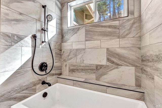 bathroom featuring washtub / shower combination