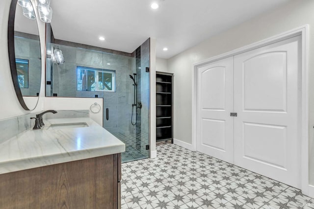 bathroom with a stall shower, recessed lighting, vanity, and tile patterned floors