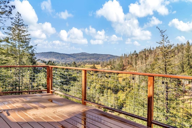 wooden terrace with a mountain view