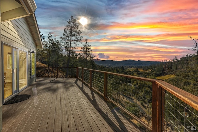 wooden deck featuring a mountain view