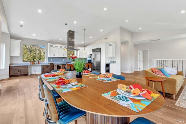 dining area with recessed lighting, visible vents, and light wood finished floors