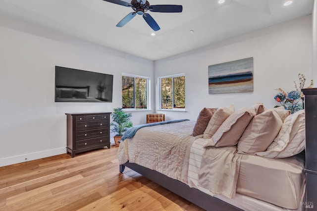 bedroom featuring light wood finished floors, ceiling fan, baseboards, and recessed lighting