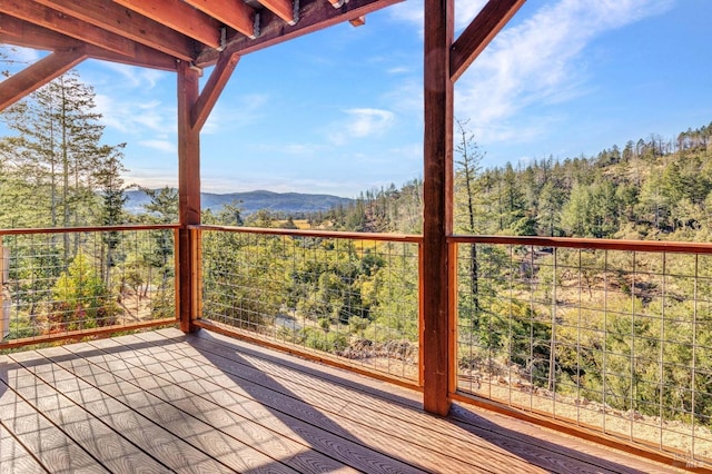 wooden terrace featuring a mountain view