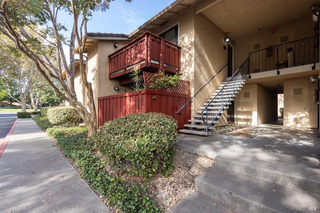 view of property exterior featuring a balcony