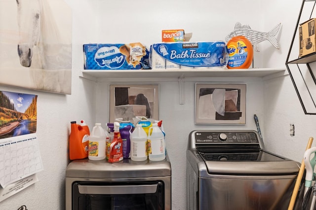 laundry room with independent washer and dryer