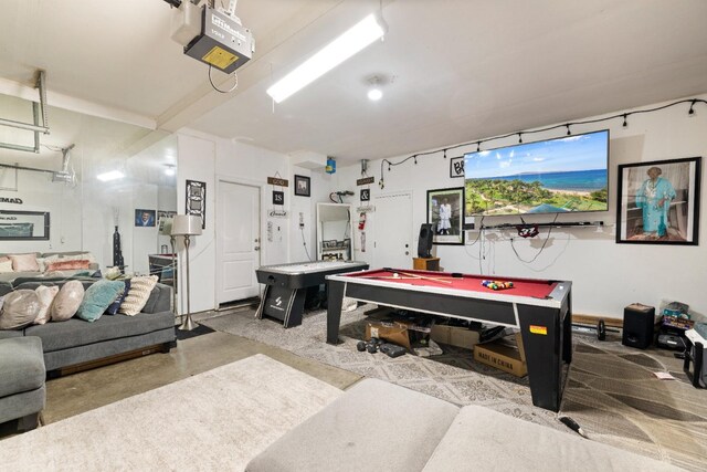 playroom with concrete floors and pool table