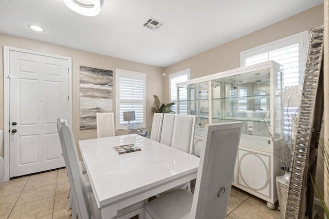 dining area featuring light tile patterned floors