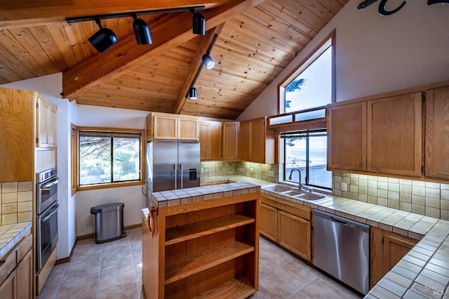 dining area featuring ceiling fan, a healthy amount of sunlight, light wood-type flooring, and sink