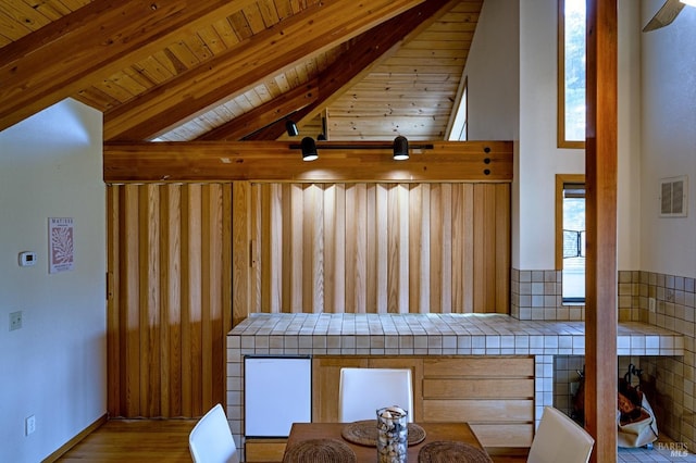 bathroom with toilet and wooden ceiling