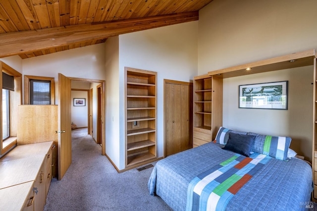 carpeted bedroom featuring wooden ceiling and vaulted ceiling