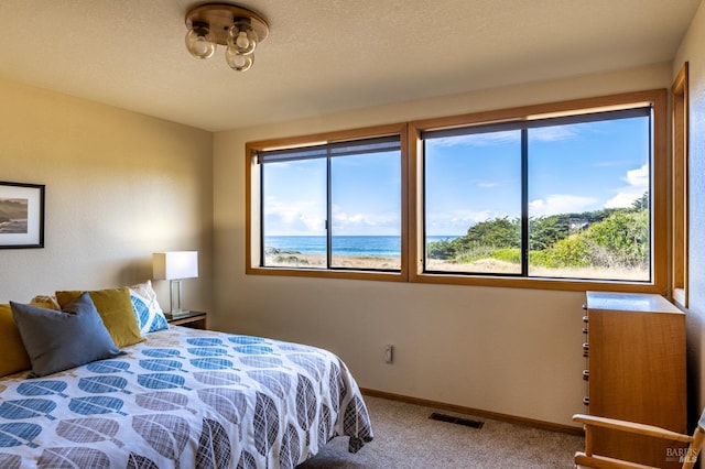 unfurnished bedroom featuring carpet, lofted ceiling with beams, and wooden ceiling