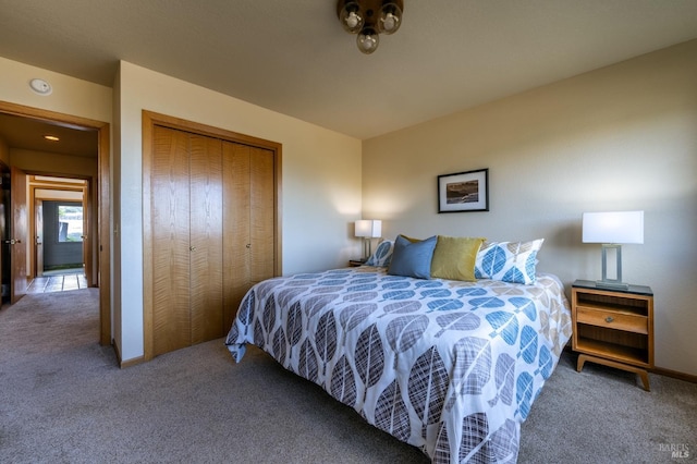 bedroom with a textured ceiling, carpet floors, and a water view