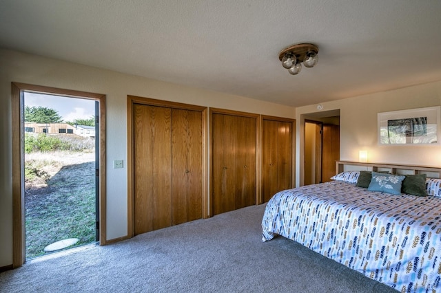 carpeted bedroom with a textured ceiling