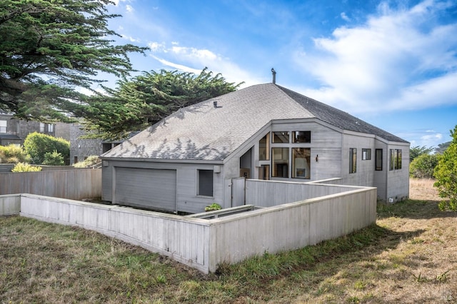 view of side of home with a garage