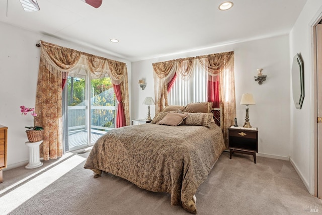 bedroom featuring light colored carpet and access to outside