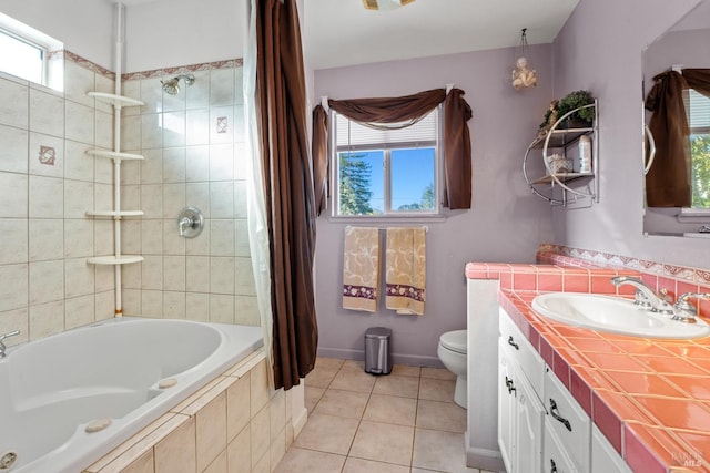 full bathroom with toilet, tile patterned flooring, and a healthy amount of sunlight