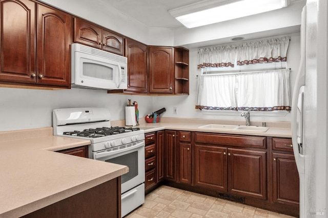 kitchen with white appliances and sink