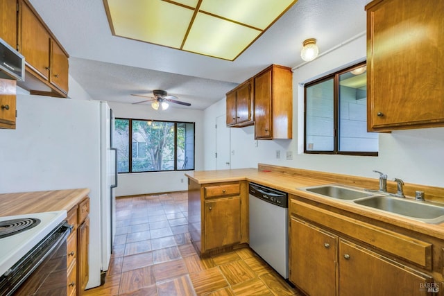 kitchen with ceiling fan, sink, stainless steel dishwasher, white range with electric stovetop, and extractor fan