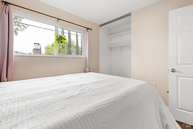 bedroom featuring multiple windows
