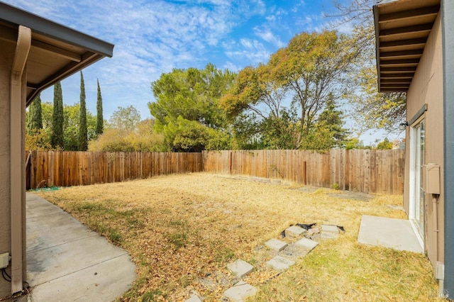 view of yard with a fenced backyard