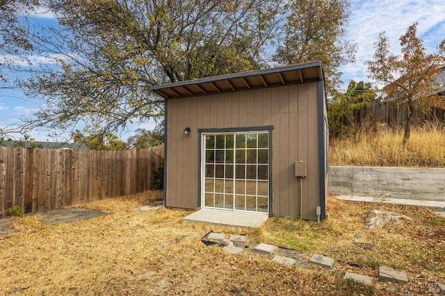 view of shed featuring a fenced backyard