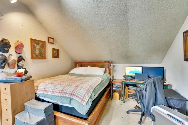 bedroom featuring light colored carpet, lofted ceiling, and a textured ceiling