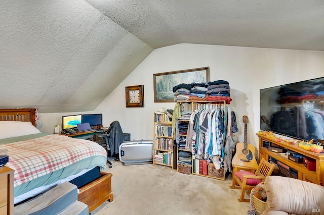 bedroom featuring carpet flooring, a textured ceiling, and vaulted ceiling