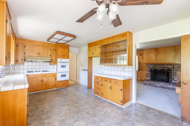 840 W Railroad Ave, Cotati, CA 94931 - kitchen with a sink, under cabinet range hood, tile countertops, white appliances, and a ceiling fan