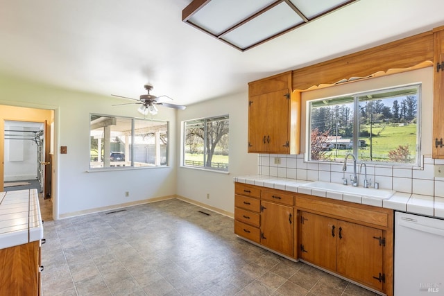 840 W Railroad Ave, Cotati, CA 94931 - kitchen with tasteful backsplash, ceiling fan, dishwasher, and a sink