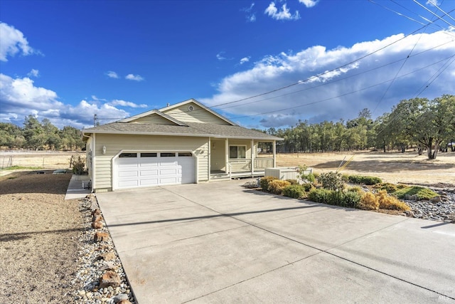 view of front of house with a garage and a porch