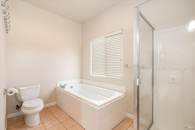 bathroom with tile patterned flooring, toilet, and plus walk in shower