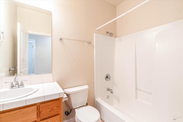 full bathroom featuring shower / bathing tub combination, vanity, and toilet