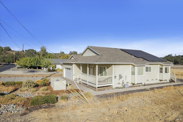 view of front of property with a garage and a porch