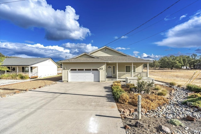 ranch-style house with a garage and covered porch