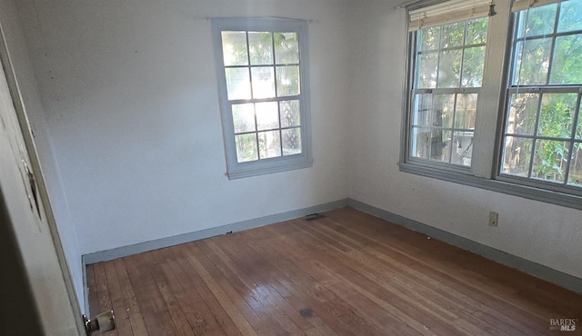 unfurnished room featuring wood-type flooring