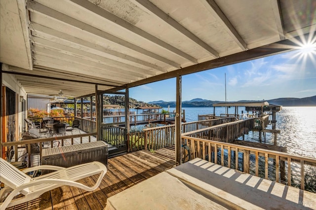 dock area featuring a water and mountain view