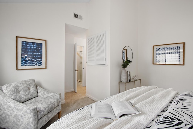 carpeted bedroom with lofted ceiling