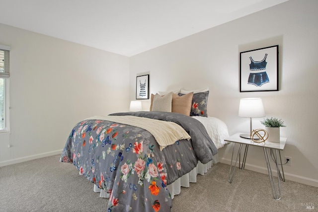 bedroom with light colored carpet