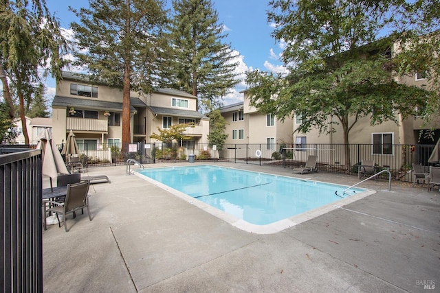 view of swimming pool featuring a patio area