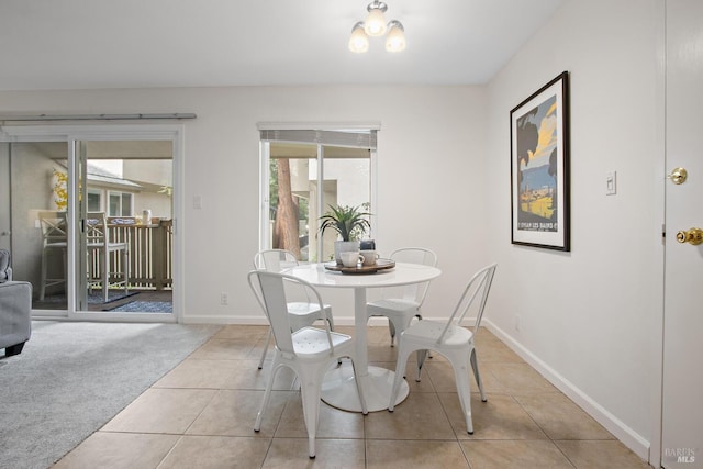 view of carpeted dining space