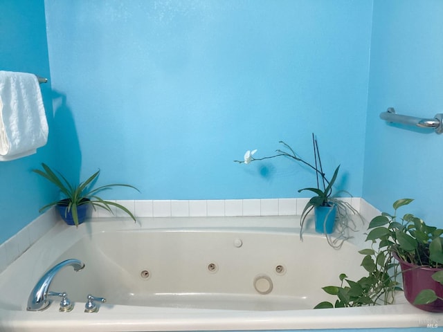 bathroom featuring a tub to relax in