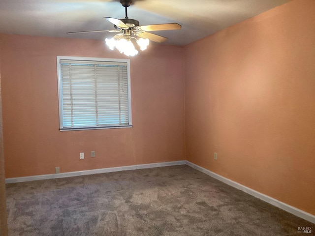 empty room featuring carpet flooring and ceiling fan